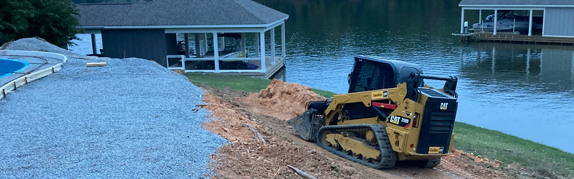 Bobcat tractor moving dirt on an shore embankment